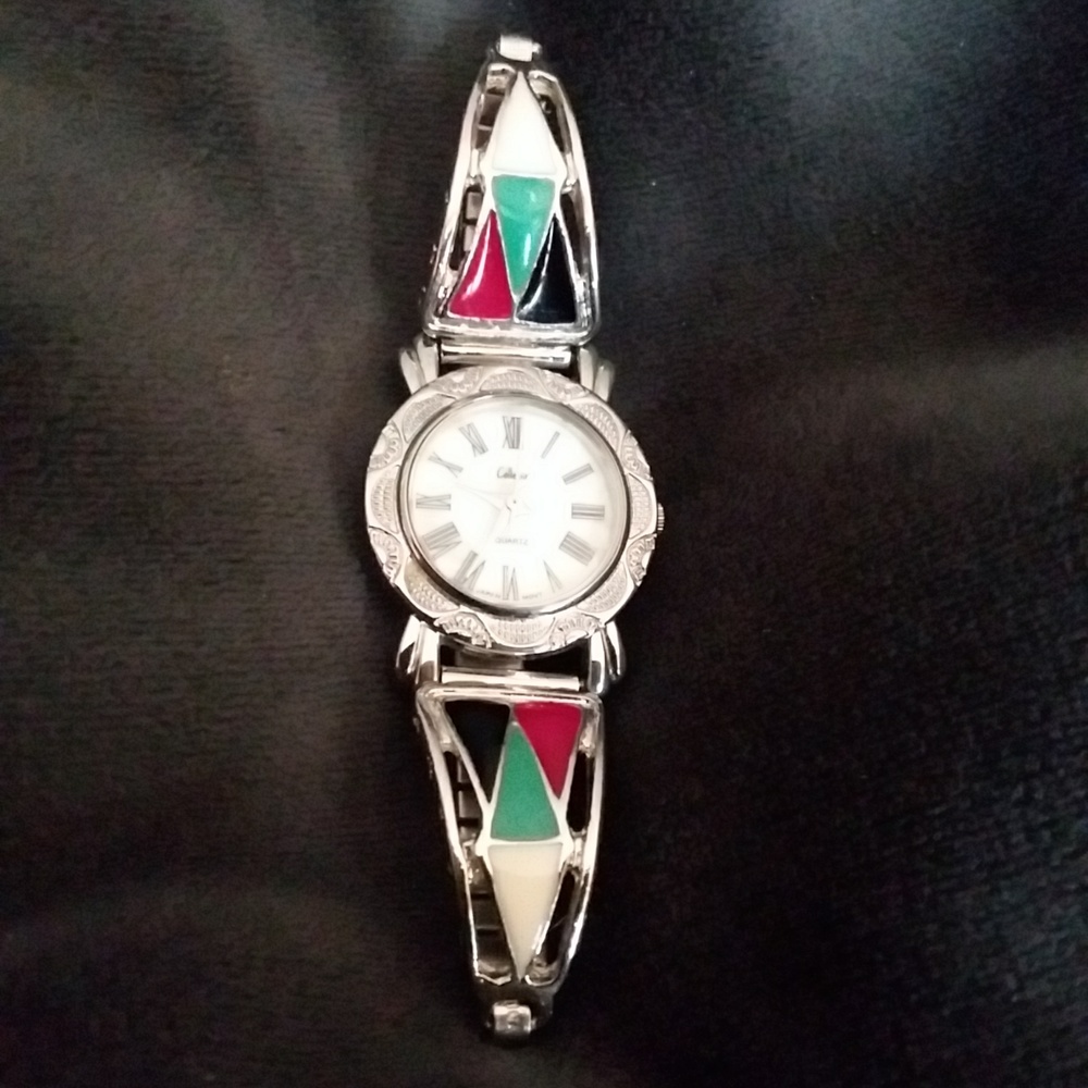 Quartz watch. Collectif but not 100% sure on brand. (Can't see it well!)